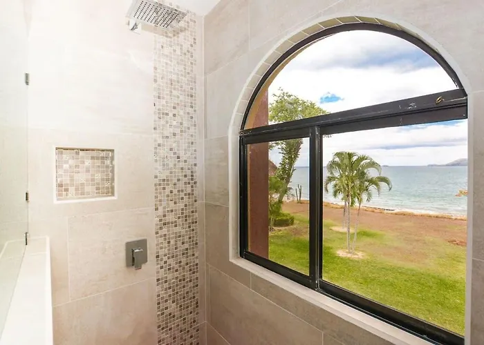 Elegant 3br Beachfront With Spacious Interior, Ocean-view Terrace & Direct Access To Holiday home *